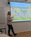 Postdoc Mette Kielsholm Thomsen teaching high scool students about inequality in health